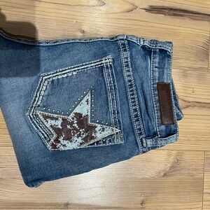 Rock & Roll Cowgirl Distressed Blue Jeans with Star Accent